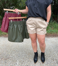 Load image into Gallery viewer, P21037 Faux leather high waisted shorts featuring elastic waistband. Pocket at sides.