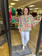 Load image into Gallery viewer, T22612 Printed v-neck long sleeve top featuring self-tie detail.