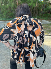 Load image into Gallery viewer, T21863 Printed mock neck long sleeve top featuring open back with self-tie at back neck.