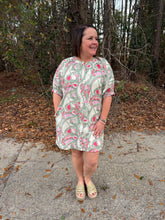 Load image into Gallery viewer, Printed short puff sleeve mini dress featuring gathered neckline. Button closure at front. Side pockets.