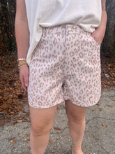 Load image into Gallery viewer, Leopard print high-waist shorts featuring front button and zipper closure.