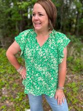 Load image into Gallery viewer, T22694 Floral print v-neck short sleeve top featuring ruffled sleeves. Self-tie detail at neckline.
