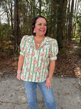 Load image into Gallery viewer, Botanical stripe print short puff sleeve top featuring self-tie cuff detail. Button closure at front. Round neckline.