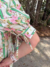 Load image into Gallery viewer, Botanical stripe print short puff sleeve top featuring self-tie cuff detail. Button closure at front. Round neckline.