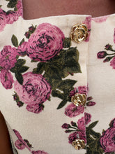 Load image into Gallery viewer, Floral print sleeveless mini dress featuring gold tone rose button detail at front.