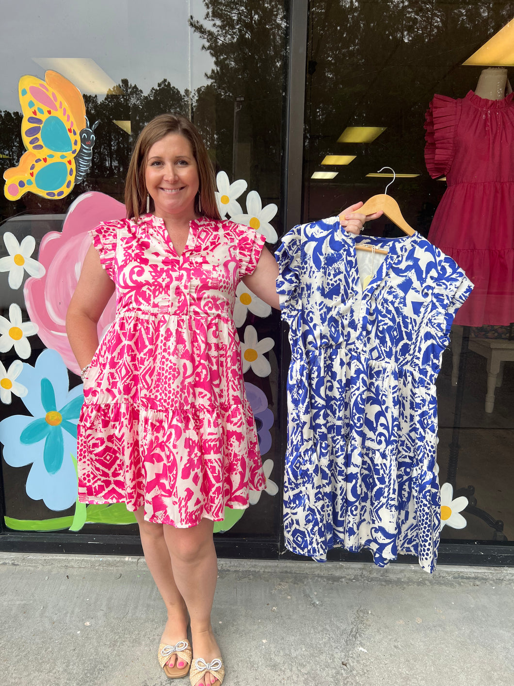 H11141 Satin print dress with slit neck, layer frilled cap sleeves, side pockets, and tiered layer.