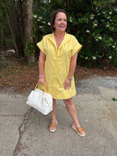 Load image into Gallery viewer, Solid short sleeve mini dress featuring hidden button placket.