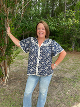 Load image into Gallery viewer, T24342 Floral print v-neck short sleeve top featuring ric rac trim. Self tie at front.