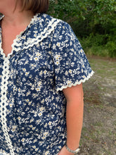 Load image into Gallery viewer, T24342 Floral print v-neck short sleeve top featuring ric rac trim. Self tie at front.