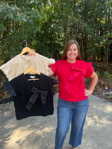 T24821 Solid short sleeve round neck top with bow detail