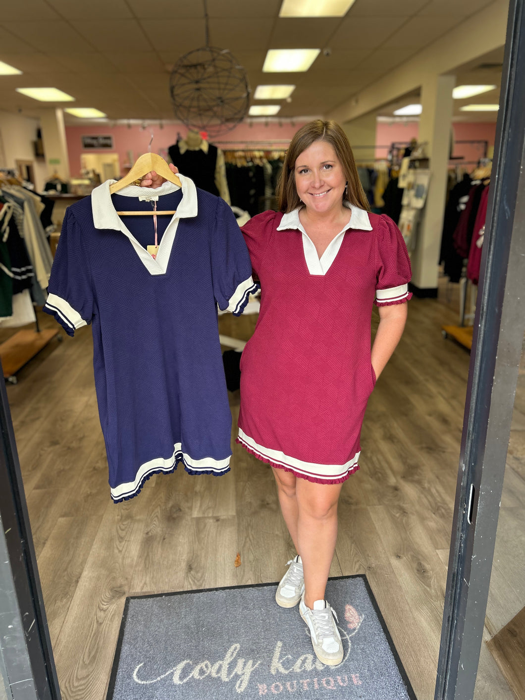 Solid textured short sleeve v-neck collared mini dress featuring pockets at side