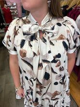 Load image into Gallery viewer, D24713 Satin printed short sleeve mini dress featuring self tie at neck