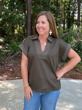 Load image into Gallery viewer, Solid short sleeve knit top featuring a V-neck with contrast stitching