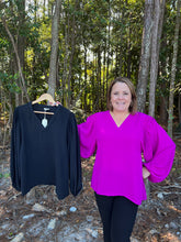 Load image into Gallery viewer, Solid top with V-neck, smocked shoulders, and long peasant sleeves.