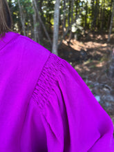Load image into Gallery viewer, Solid top with V-neck, smocked shoulders, and long peasant sleeves.