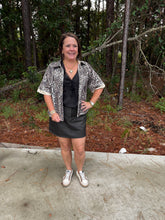 Load image into Gallery viewer, Short sleeves button down leopard top with solid contrast accent.