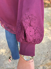 Load image into Gallery viewer, Solid long balloon sleeve with lace trim detail at sleeve cuffs and hem