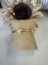 Load image into Gallery viewer, Gold Metal Hammered Stretch Bracelet with White Bows