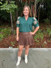 Load image into Gallery viewer, Faux leather pleated skirt featuring hidden self shorts
