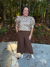 Load image into Gallery viewer, Animal print short puff sleeve top featuring ruffled mock neck