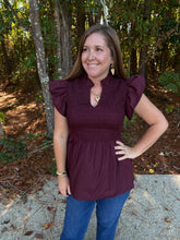 Load image into Gallery viewer, Solid flutter sleeve peplum top featuring smocked bodice