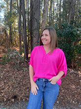 Load image into Gallery viewer, Solid dolman top featuring V-neck accent with trenza detail.