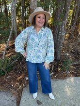 Load image into Gallery viewer, Floral print long sleeve button-down top featuring collar and buttoned cuffs.
