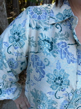 Load image into Gallery viewer, Floral print long sleeve button-down top featuring collar and buttoned cuffs.