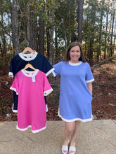 Load image into Gallery viewer, Solid short sleeve mini dress featuring contrast trim round neck, cuffs, and hem. Button closure at back.