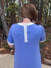Load image into Gallery viewer, Solid short sleeve mini dress featuring contrast trim round neck, cuffs, and hem. Button closure at back.