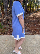 Load image into Gallery viewer, Solid short sleeve mini dress featuring contrast trim round neck, cuffs, and hem. Button closure at back.