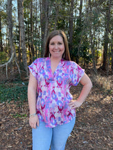 Load image into Gallery viewer, T22255 Printed v-neck short sleeve top featuring permanent rolled cuffs.