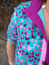 Load image into Gallery viewer, Print short sleeve mini dress featuring contrast trim and button closure at front.