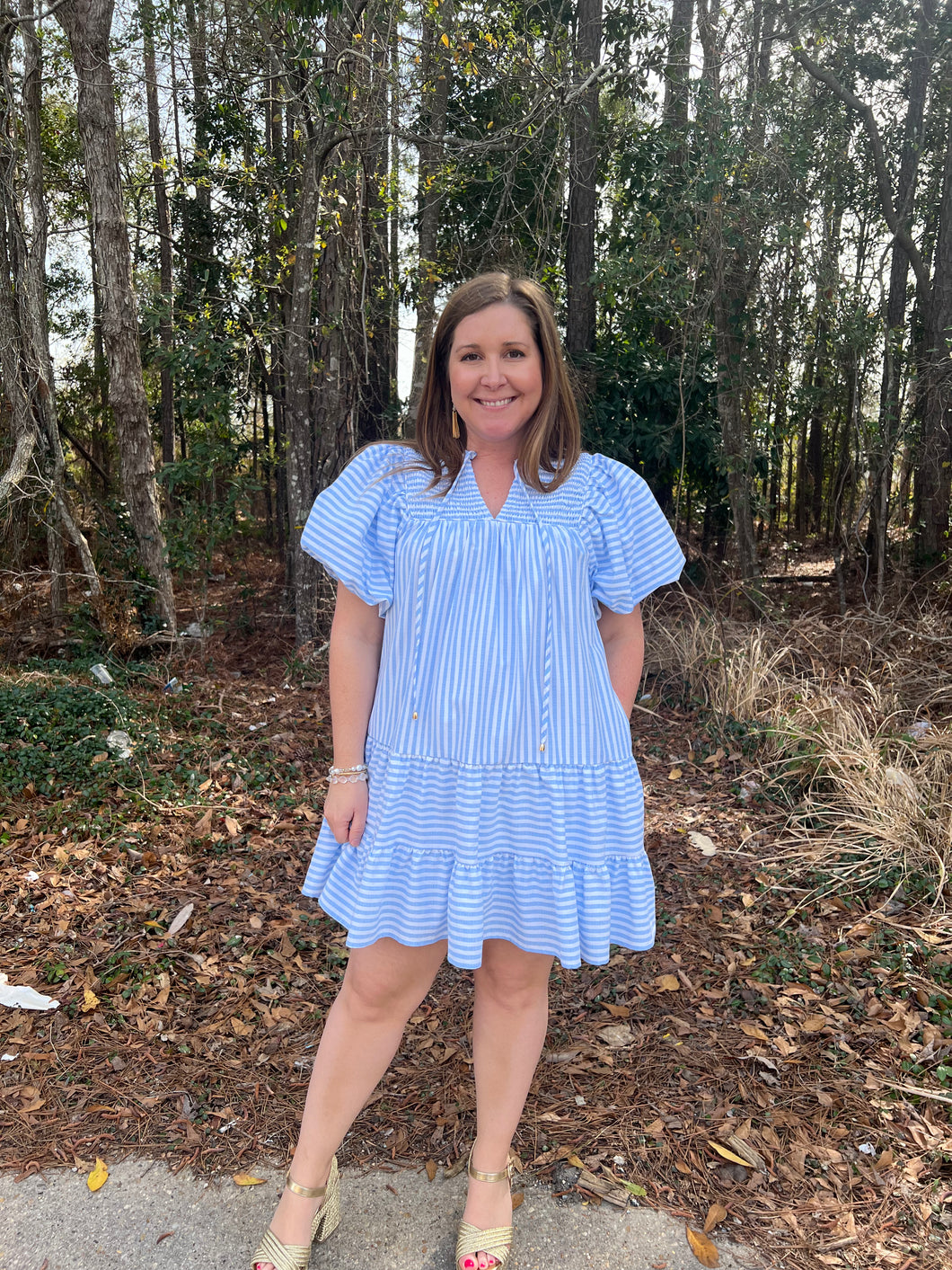 D23089 Stripe print bubble sleeve mini dress featuring self tie at neck. Pocket at sides.