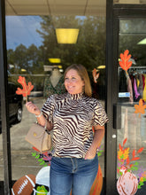 Load image into Gallery viewer, T21563 Zebra print high neck bubble sleeve top featuring self-tie at back.