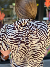 Load image into Gallery viewer, T21563 Zebra print high neck bubble sleeve top featuring self-tie at back.