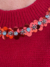 Load image into Gallery viewer, Solid short puff sleeve knit top with a round neckline. Rhinestone and pearl trim at neckline and front pocket.