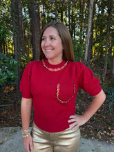 Load image into Gallery viewer, Solid short puff sleeve knit top with a round neckline. Rhinestone and pearl trim at neckline and front pocket.