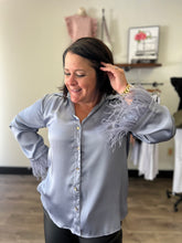 Load image into Gallery viewer, T18824 Satin button up v-neck top featuring feather trim at sleeves