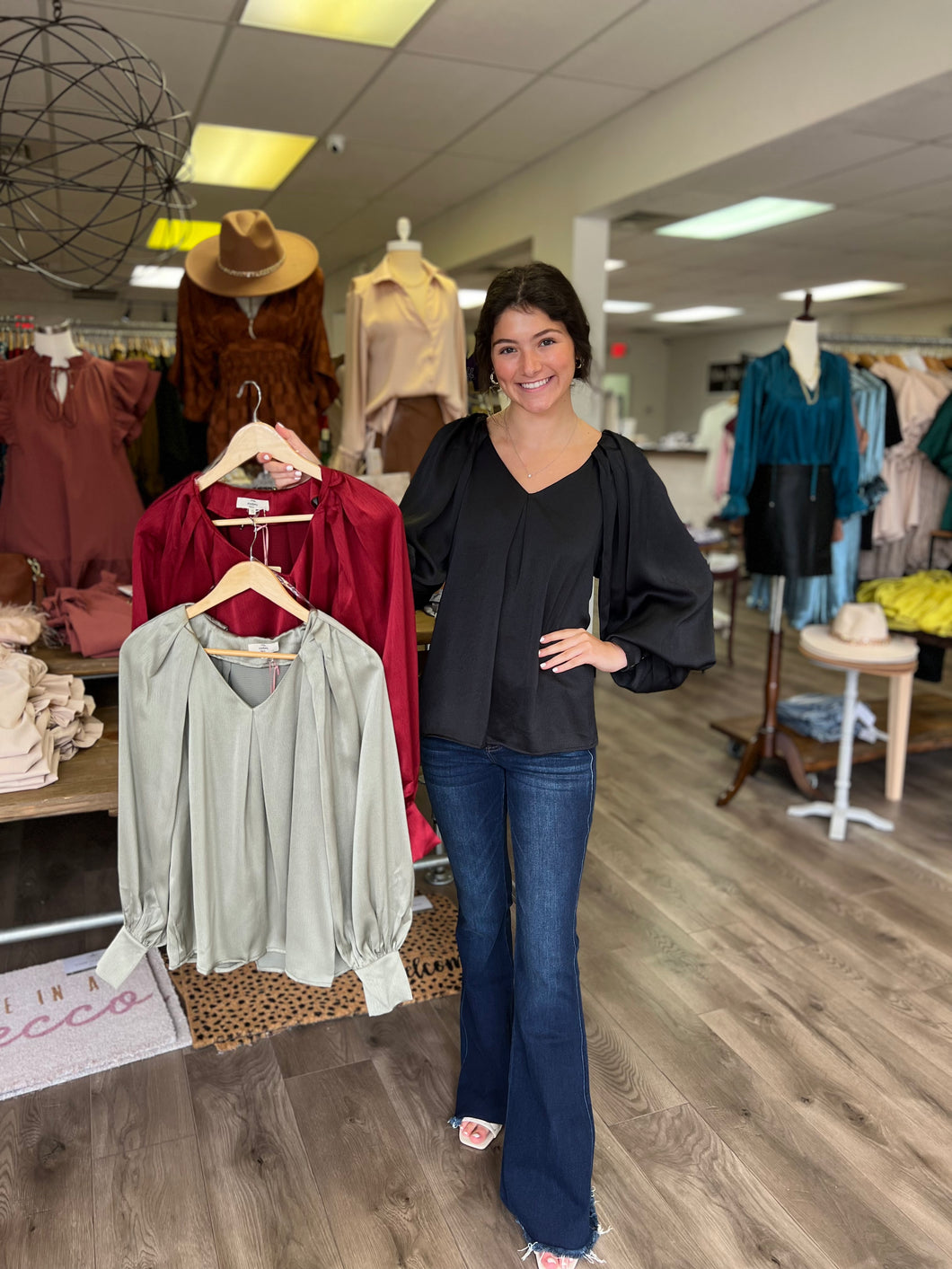 T18854 Satin v-neck long sleeve top featuring pleated detail along neckline